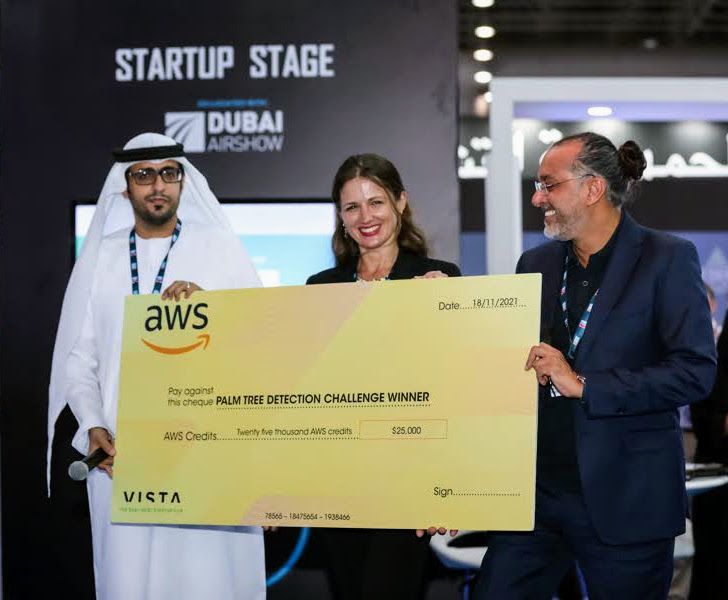 ForestSAT receiving the AWS Space Challenge winner's cheque on the Startup Stage at the Dubai Airshow, November 2021